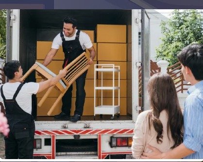 Mover carefully loading furniture